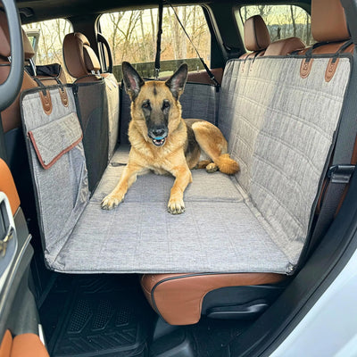 German Shepherd on the grey back seat deck for big dogs, side flaps covering the rear doors